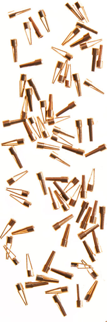 A close-up of Miniature Mosquito Clip Electronic Connectors made of Beryllium Copper.