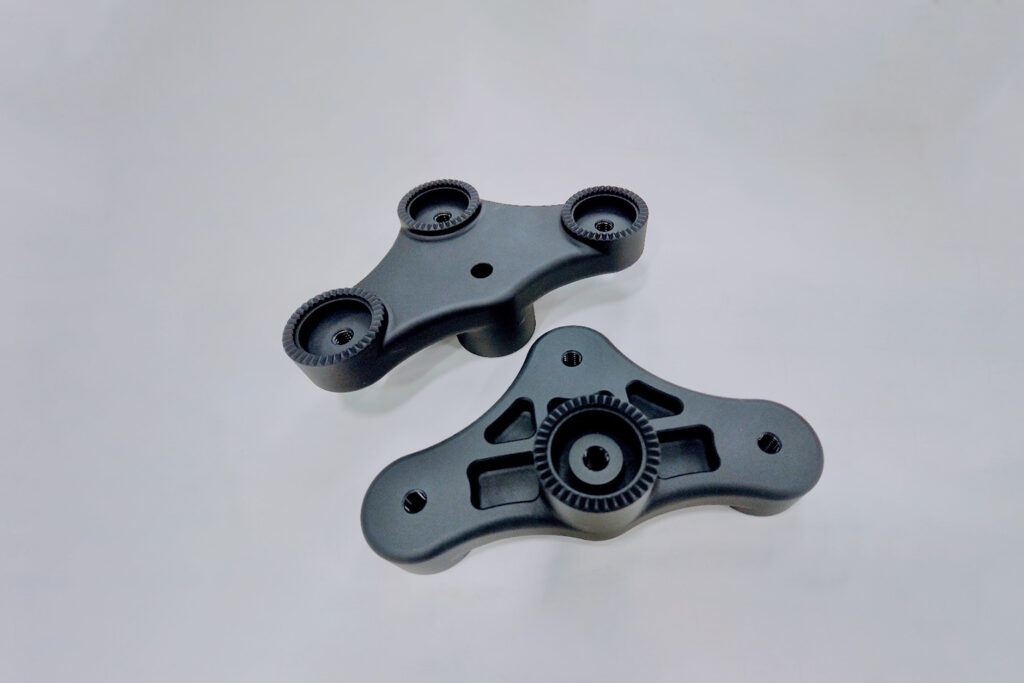 Swiss machined aluminum components with hard coat anodizing